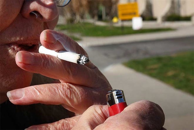 Smoking breaks are at the center of a federal lawsuit filed by a Union County woman who says she was illegally singled out to work additional hours to cover the time she spent on smoking breaks. [Tom Dodge/Dispatch file photo]