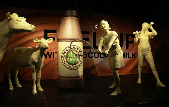 This year’s display is a salute to chocolate milk, the official beverage of Ohio High School Athletic Association (OHSAA). Inside the dairy cooler, the traditional butter cow and calf is joined by a larger-than-life bottle of chocolate milk, along with four high school athletes. (Ohio Dairy Association)