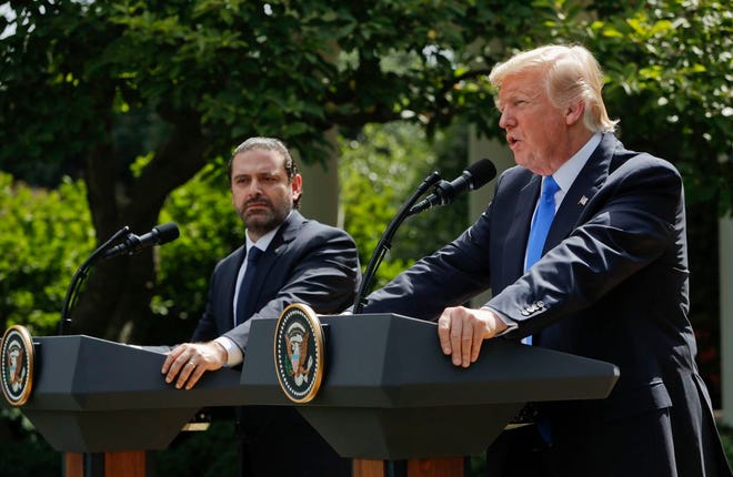 President Donald Trump, with Lebanese Prime Minister Saad Hariri, speaks during their joint news conference in the Rose Garden of the White House in Washington, Tuesday, July 25, 2017. (AP Photo/Pablo Martinez Monsivais)