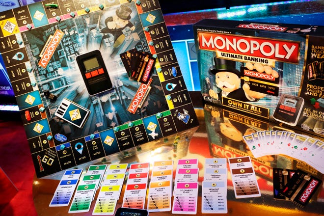 Hasbro announced Monday that it's second-quarter profit jumped 30 percent, thanks to rising sales of Transformers action figures and Monopoly board games, such as the Monopoly Ultimate Banking Game shown here. [AP Photo, file /Mark Lennihan]