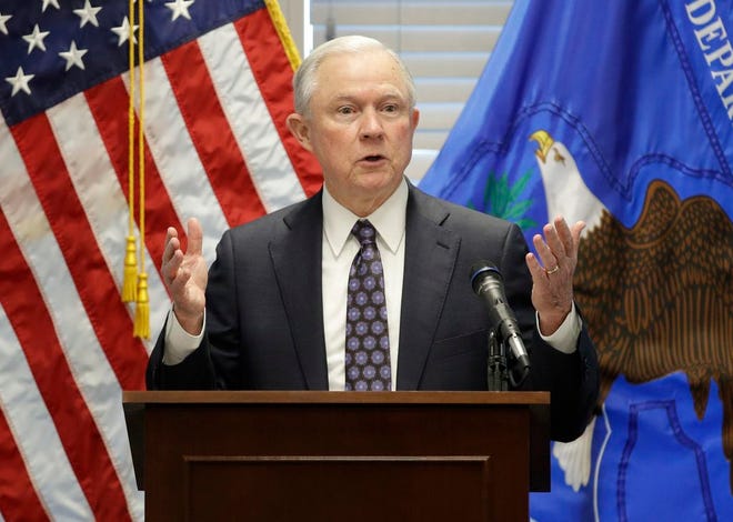 In this July 12, 2017, file photo, Attorney General Jeff Sessions speaks to federal, state and local law enforcement officials about sanctuary cities and efforts to combat violent crime, in Las Vegas. The Justice Department escalated its promised crackdown on so-called sanctuary cities on July 25, saying it will no longer give cities coveted grant money unless they give federal immigration authorities access to jails and provide advance notice when someone in the country illegally is about to be released. (AP Photo/John Locher, File)