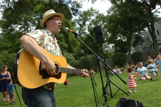 Randall Kromm gets the crowd moving to the music during a prior year's Four Corners Music Festival in Melrose. The event returns on Saturday, July 29 this year. [Wicked Local File Photo / Nicole Goodhue Boyd]