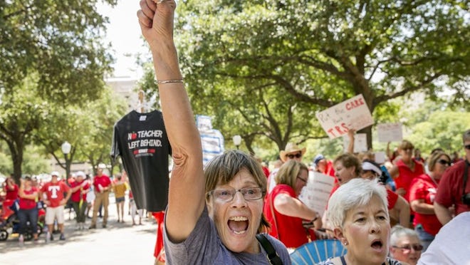 Theresa Bessette, left, and Terry Whistler, retired educators from Oak Hill Elementary School, participate in rally at the Capitol on Monday July 17, 2017, the day before a special starts, to alert representatives to issues that will affect public schools. JAY JANNER / AMERICAN-STATESMAN
