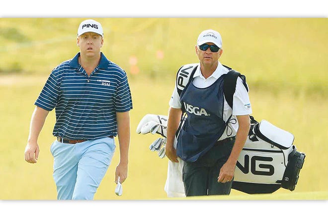 Dru Love and father (and caddie) Davis Love III walk to the second green during the first round of the 2017 U.S. Open at Erin Hills last month.