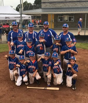 The Gonzales Nationals celebrate their victory in the USSSA All-Star State Tournament in Livingston.