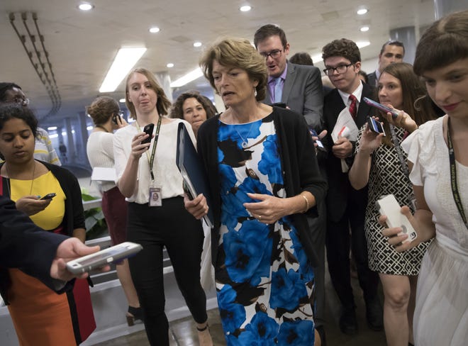 Sen. Lisa Murkowski, R-Alaska, heads to the chamber for a vote, on Capitol Hill in Washington, Thursday, July 20, 2017. Majority Leader Mitch McConnell is spurring Republican senators to resolve internal disputes that have pushed their marquee health care bill to the brink of oblivion, a situation made more difficult for the GOP because of Sen. John McCain's jarring diagnosis of brain cancer. (AP Photo/J. Scott Applewhite)
