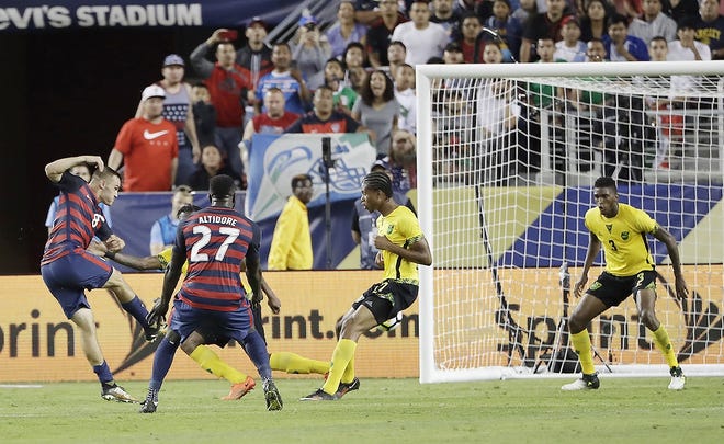 United States' Jordan Morris scores his team's second goal against Jamaica during the second half of the Gold Cup final soccer match in Santa Clara, Calif., Wednesday. [MARCIO JOSE SANCHEZ/ASSOCIATED PRESS]