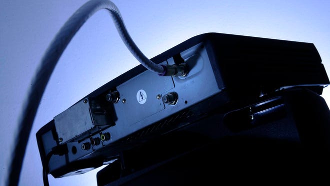 A cable box on top of a television set in Philadelphia. (Associated Press, file)