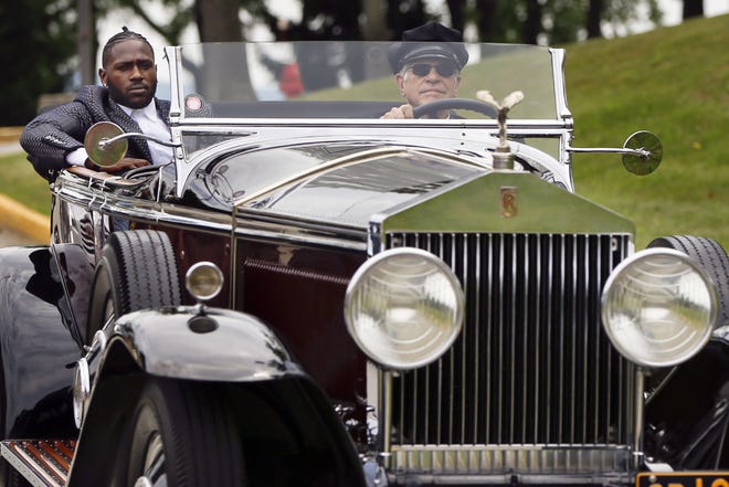 Pittsburgh Steelers wide receiver Antonio Brown, left, arrives in a chauffeur driven 1931 Rolls Royce Phantom 1 at NFL training camp in Latrobe, Pa. on Thursday. [AP Photo/Keith Srakocic]
