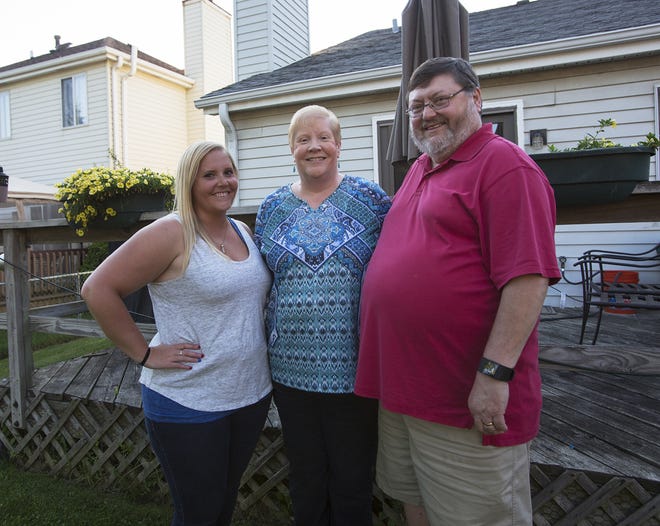 Wendy Filip, center, with daughter Kristin and husband Joe, had to pick up the pieces after Joe Filip's mother killed herself rather than comply with her doctor's ultimatum to quit smoking. She thinks smoking should be illegal. [Mike Mantucca/Chicago Tribune/TNS]