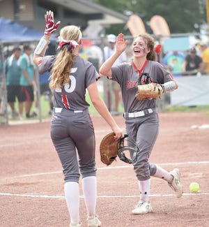 Ballard shortstop Isabella Johnson goes to high-five first baseman Maggie Larson (15) after the Bombers’ 6-1 victory over Charles City in the Class 4A semifinals at the state softball tournament July 20 in Fort Dodge.