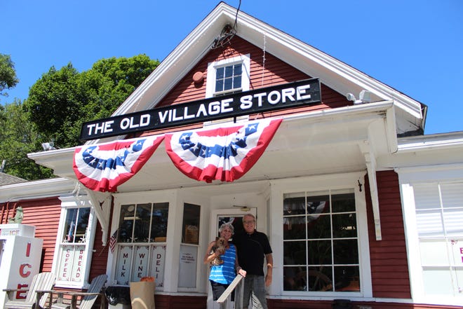 Leslie and Dan Devlin at the West Barnstable store they have owned for two years. [PHOTO BY RACHAEL DEVANEY]