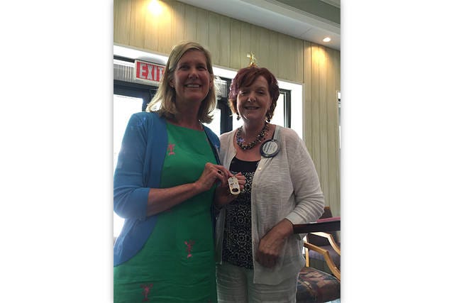 SIGNIFICANT CONTRIBUTIONS — Dr. Terry Worrell, left, receives the ‘Difference Maker’ award from Asheboro Rotary Club President Elizabeth Mitchell at the July 25 meeting. (Contributed photo)