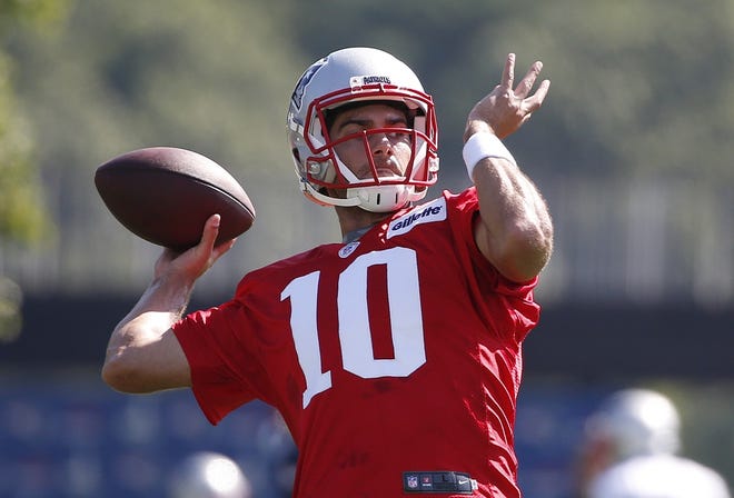 Patriots quarterback Jimmy Garoppolo (10) passes during NFL football training camp, Friday, July 28, 2017, in Foxborough, Mass. [AP Photo/Michael Dwyer]