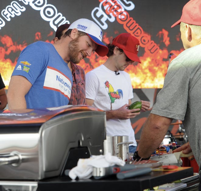 NASCAR drivers Dale Earnhardt Jr., left, and Ryan Blaney take part in the Hungry Fan Throwdown cooking competition as part of the Pocono Fan Fest at Pocono Raceway in Long Pond on Friday. [Keith R. Stevenson/Pocono Record]