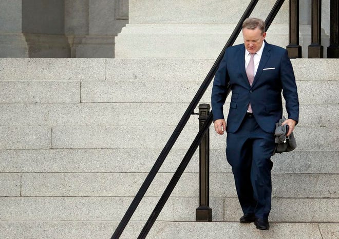Former White House press secretary Sean Spicer walks down the steps of the Eisenhower Executive Office Building towards the White House, Friday, July 21.