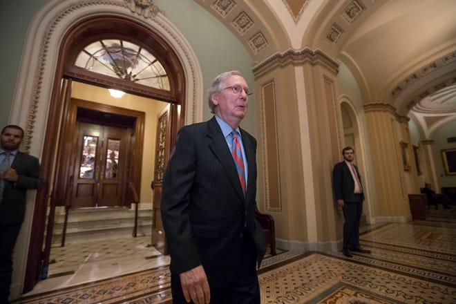 Senate Majority Leader Mitch McConnell of Ky. leaves the Senate chamber on Capitol Hill in Washington, Thursday, July 27, 2017, after a vote as the Republican majority in Congress remains stymied by their inability to fulfill their political promise to repeal and replace “Obamacare” because of opposition and wavering within the GOP ranks. (AP Photo/J. Scott Applewhite)