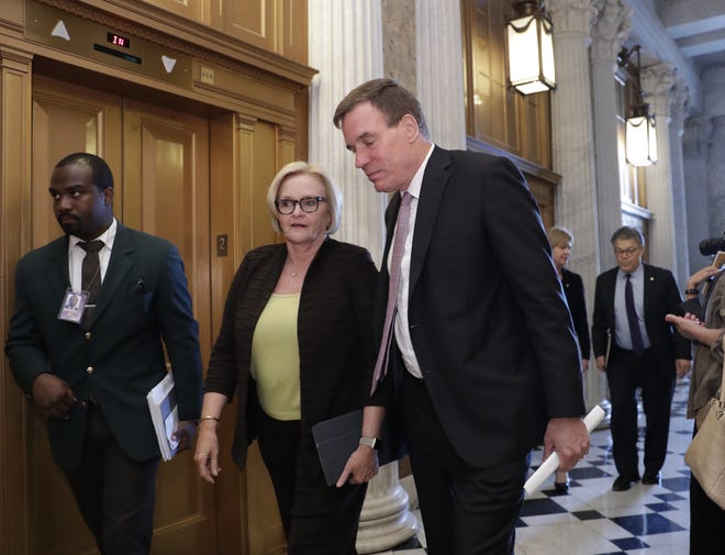 Sen. Claire McCaskill, D-Mo., left, and Sen. Mark Warner, D-Va., arrive at the chamber to vote as the Republican-run Senate rejected a GOP proposal to scuttle President Barack Obama's health care law and give Congress two years to devise a replacement, Wednesday, July 26, 2017, in Washington. President Donald Trump and Senate Majority Leader Mitch McConnell, R-Ky., have been stymied by opposition from within the Republican ranks. (AP Photo/J. Scott Applewhite)