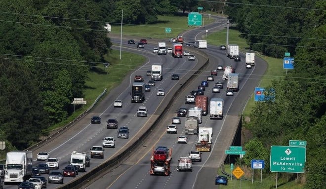 Traffic moves along I-85 at Exit 23 near Lowell and McAdenville on a recent morning. This six-lane section is part of what the state plans to widen to eight lanes within the next decade. [Mike Hensdill/The Gaston Gazette]