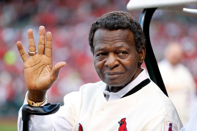 FILE - This May 17, 2017 file photo shows Lou Brock, a member of the St. Louis Cardinals' 1967 World Series championship team, taking part in a ceremony honoring the 50th anniversary of the victory before the start of a baseball game between the St. Louis Cardinals and the Boston Red Sox in St. Louis. Brock says he is free of cancer more than three months after the 78-year-old St. Louis Cardinals great announced he had been diagnosed with a type of blood cancer. Brock said in a statement Friday, July 28, 2017 that a doctor's diagnosis that he had conquered multiple myeloma was "the greatest news ever." (AP Photo/Jeff Roberson, file)