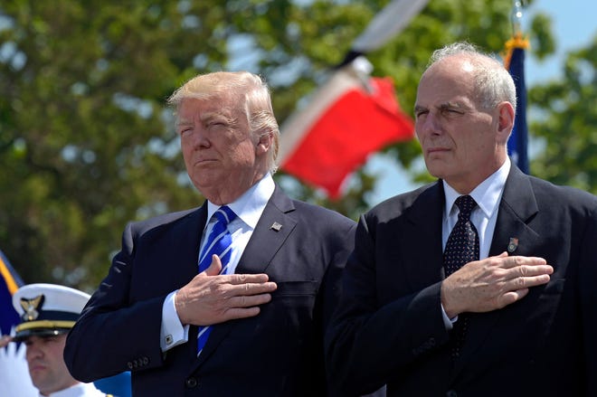 In this May 17, 2017, file photo, President Donald Trump and Homeland Security Secretary John Kelly listen to the national anthem during commencement exercises at the U.S. Coast Guard Academy in New London, Conn. Six months into presidency, Trump is saddled with a stalled agenda, a West Wing that resembles a viper’s nest, a cloud of investigations and a Republican Party that is starting to break away. Against that daunting backdrop, Trump moved July 28 to overhaul his senior team, installing Kelly as White House chief of staff. The hard-nosed, retired general replaces Reince Priebus, a Republican operative who was skeptical of Trump’s electoral prospects last year.(AP Photo/Susan Walsh, File)