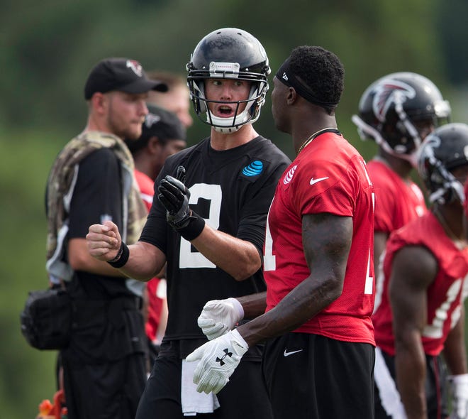 Atlanta Falcons quarterback Matt Ryan (2) talks with receiver Julio Jones during their training camp on Friday in Flowery Branch. (AP Photo/John Bazemore)