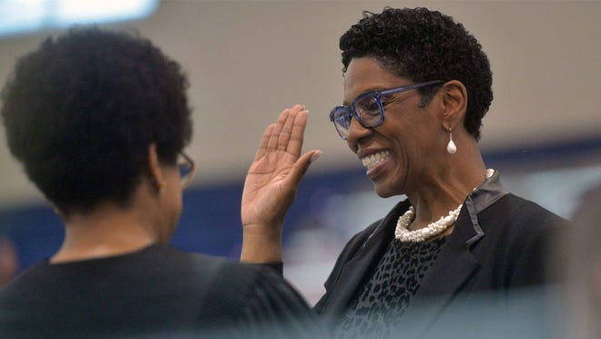 FILE - Ann Levett, right, is sworn in as school superintendent by Judge Tammy Stokes at a ceremony at Beach High School on May 31. Levett faces a host of challenges and changes as the new school year begins for Savannah-Chatham Public Schools students on Thursday.