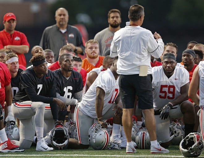 Ohio State coach Urban Meyer addresses the team at the Woody Hayes Athletic Center during the first day of preseason practice on Thursday. The Buckeyes should have a deep roster this season, with a healthy mix of returning starters and highly ranked recruiting classes. [Kyle Robertson/Dispatch]