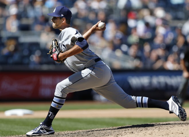 Recently-acquired relief pitcher Steve Cishek throws for the Tampa Bay Rays during the sixth inning against the New York Yankees in New York on unday. [KATHY WILLENS/AP PHOTO]