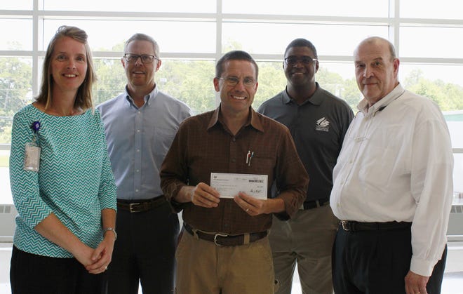 From left to right: Emily Sisk, CCC grants development coordinator; Ken Mooney, vice president of continuing education; George Lynn, maintenance manager at the former PPG Industries; Bruce Mack, dean of advanced manufacturing and public services; and Rusty Patterson, CCC Foundation executive director. [Special to The Star]