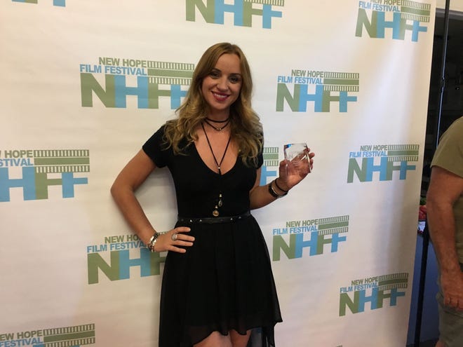 Elena Beuca poses with the Female Eye Filmmaker Award at the 2017 New Hope Film Festival. Her film "D-Love" also won the Audience Choice Award for Best Narrative Feature.