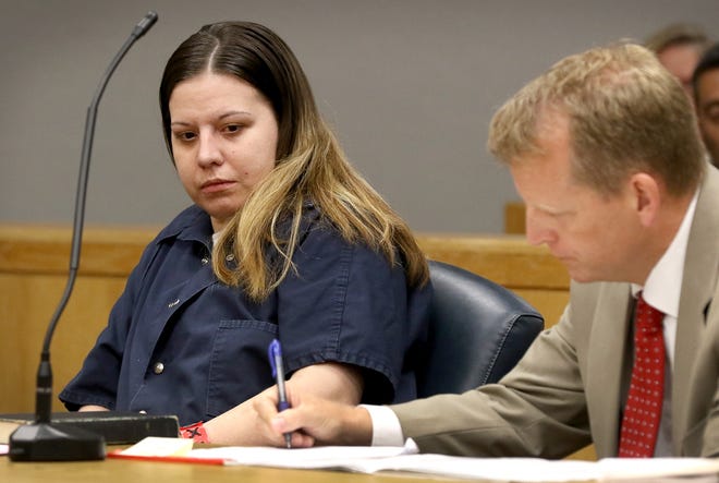 Iva Dawn Helms sits in the courtroom with her attorney Stuart Higdon at the Gaston County Courthouse Monday morning. Helms pleaded guilty to second-degree murder in the 2016 stabbing death of James William "Jimmy" Dellinger and was sentenced to 190 to 240 months in prison. [JOHN CLARK/THE GASTON GAZETTE]