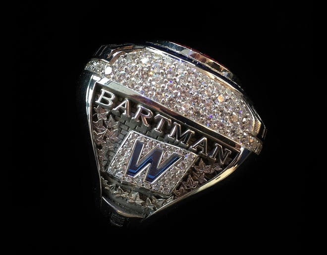 This photo provided by the Chicago Cubs shows a 2016 World Series championship ring the team announced Monday, they were giving to Steve Bartman, the fan remembered for deflecting a foul ball that appeared destined to land in left fielder Moises Alou's glove with Chicago five outs from the World Series in 2003. [Chicago Cubs via AP]
