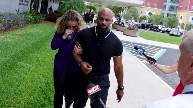 Laura Chatman walks out of the federal courthouse with family after sentencing with her husband Kenny Chatman in West Palm Beach on May 17, 2017.  (Richard Graulich / The Palm Beach Post)