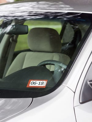 Starting Oct. 1, New Hampshire inspection stickers will be affixed to the lower, driver side corner of a vehicle's windshield. It will also have a newly redesigned appearance. [Courtesy photo by Larry Crowe/NH DMV]