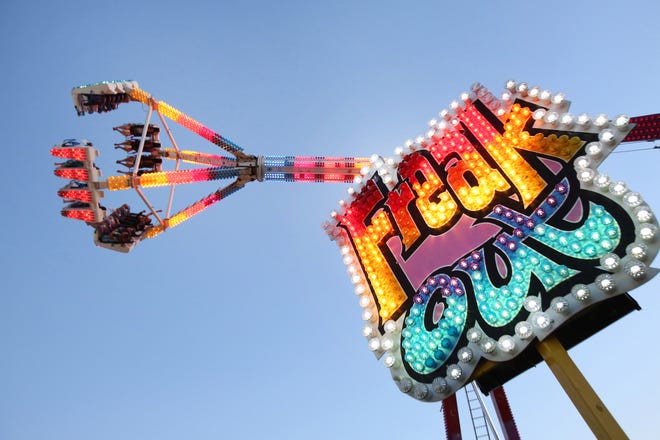 The "Freak Out" spins through the air at the Marshfield Fair in Massachusetts in 2016. File/GateHouse Media
