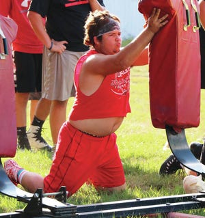 Boone lineman Colton Anderson works out with a blocking dummy Monday during the Toreadors’ summer football camp. Photo by Andrew Logue/News-Republican