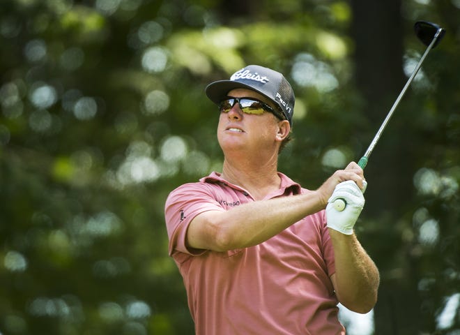 Charley Hoffman hits his tee shot on the 11th hole during the 2017 Canadian Open at the Glen Abbey Golf Club in Oakville, Ontario, on Sunday. Hoffman's playoff loss in the Canadian Open moved him to No. 10 in the standings for the U.S. Presidents Cup team. [Nathan Denette / The Canadian Press via AP]