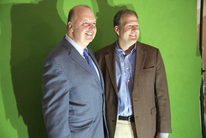 Event organizer Matt Mayberry, left, poses for a picture with Gov. Chris Sununu at a fundraiser for Community Toolbox on Wednesday night in Dover. [John Huff/Fosters.com]