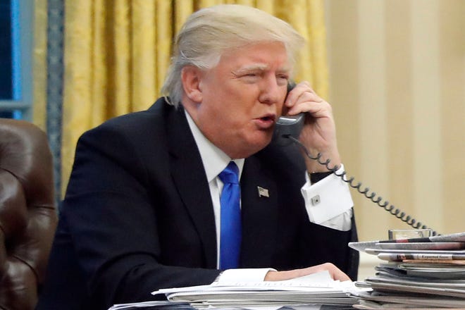 In this photo taken Jan. 28, 2017, President Donald Trump speaks on the phone with Australian Prime Minister Malcolm Turnbull in the Oval Office of the White House in Washington. Transcripts of President Donald Trump’s conversations with the leaders of Mexico and Australia in January offer new details on how the president parried with the leaders over the politics of the border wall and refugee policy, with random asides on subjects including drug abuse in New Hampshire. (AP Photo/Alex Brandon)