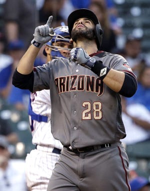 Arizona Diamondbacks' J.D. Martinez celebrates after hitting a solo home run against the Chicago Cubs during the ninth inning of a baseball game Thursday, Aug. 3, 2017, in Chicago. (AP Photo/Nam Y. Huh)