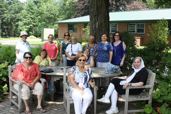 Members of the Greenleaf Garden Club relax after a morning stroll through the Massachusetts Horticulture Society’s Gardens at Elmbank. Pictured, from left, seated: Patsy Timmons, Carol Burke, Elaine McNanna, Ellen Todd and Guru S. K. Khalsa-Bob. Standing: Hazel Schroder, Phyllis Foley, Teddi Weber, Gail Reichert, Gina Hylander, Candia Cuddy and Michelle Messom. [Courtesy Photo]