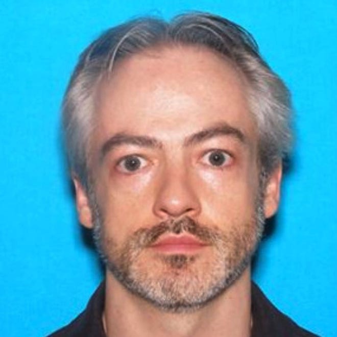 This undated photo released by the Chicago Police Department shows Wyndham Lathem, an associate professor of microbiology and immunology at Northwestern University. An arrest warrant was issued Monday, July 31, 2017, for Lathem and another man in connection to the stabbing death of a Chicago man on July 27. (Chicago Police Department via AP)