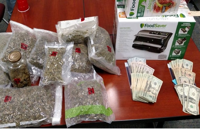 More than 6 pounds of pot and $4,500 were seized during the investigation. [Contributed photo]