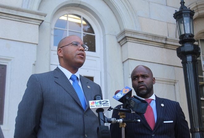 Petersburg Mayor Samuel Parham (left) and Councilman Darrin Hill (right) at a press conference annoucing the city's improved bond rating on August 4, 2017. [John Adam/progress-index.com]