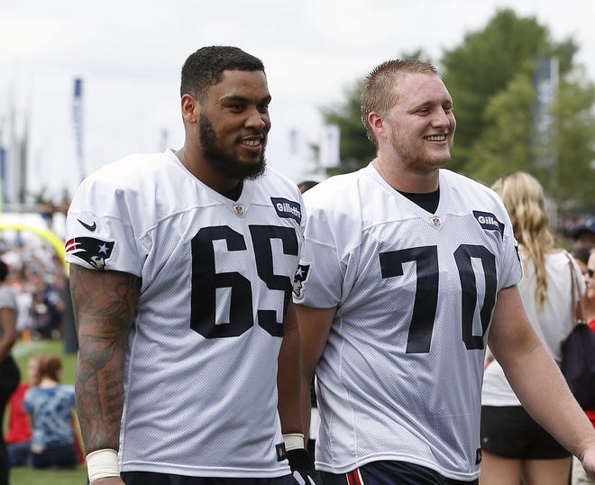 Patriots offensive lineman Cole Croston (right) is spending training camp learning how to play guard after starting at tackle for the University of Iowa. [AP Photo/Michael Dwyer]