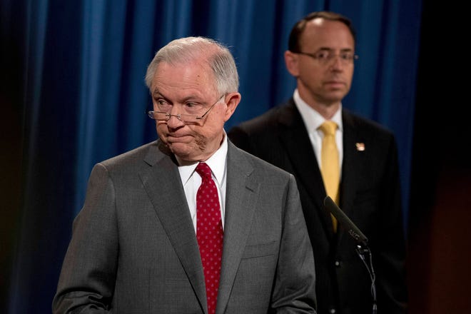 Deputy Attorney General Rod Rosenstein watches at right as Attorney General Jeff Sessions steps away from the podium during a news conference at the Justice Department in Washington, Friday, Aug. 4, 2017, on leaks of classified material threatening national security. (AP Andrew Harnik)