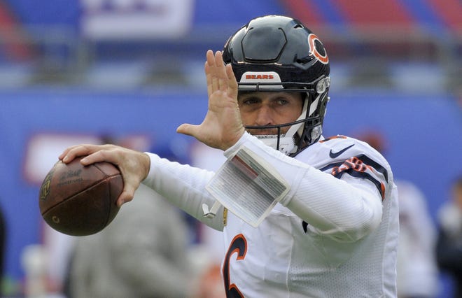 In this Nov. 20, 2016, file photo, Chicago Bears quarterback Jay Cutler (6) warms up before playing against the New York Giants in an NFL football game, in East Rutherford, N.J. A person familiar with the situation says Cutler, a free agent quarterback, has agreed to terms on a contract with the Miami Dolphins, Sunday, Aug. 6, 2017. Cutler is expected to compete with Matt Moore for the Dolphins' starting job while Ryan Tannehill remains out with a left knee injury that could sideline him for the entire season. (AP Photo/Bill Kostroun, File)