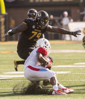Missouri defensive lineman Terry Beckner Jr. (79) made 24 tackles in seven games last year before an ACL tear ended his season. Beckner has been strong at the start of camp, drawing comparisons to Bears Pro Bowler Tommie Harris. [L.G. Patterson/The Associated Press]