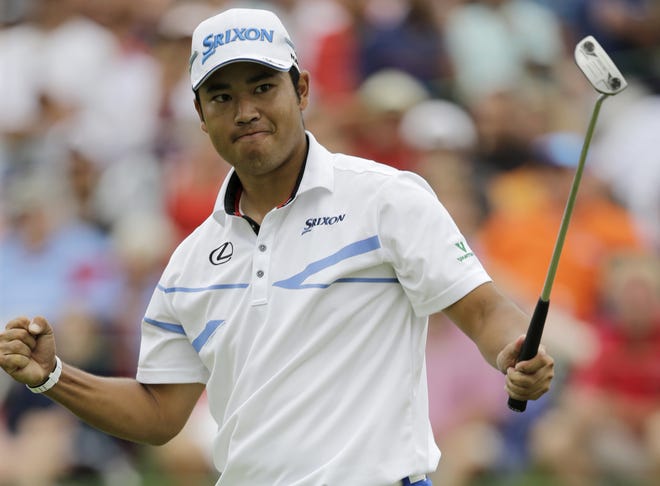 Hideki Matsuyama pumps his fist after his birdie putt on the 18th hole in the final round of the Bridgestone Invitational golf tournament at Firestone Country Club on Sunday in Akron, Ohio. Matsuyama won the tournament at 16-under par. [AP Photo / Tony Dejak]